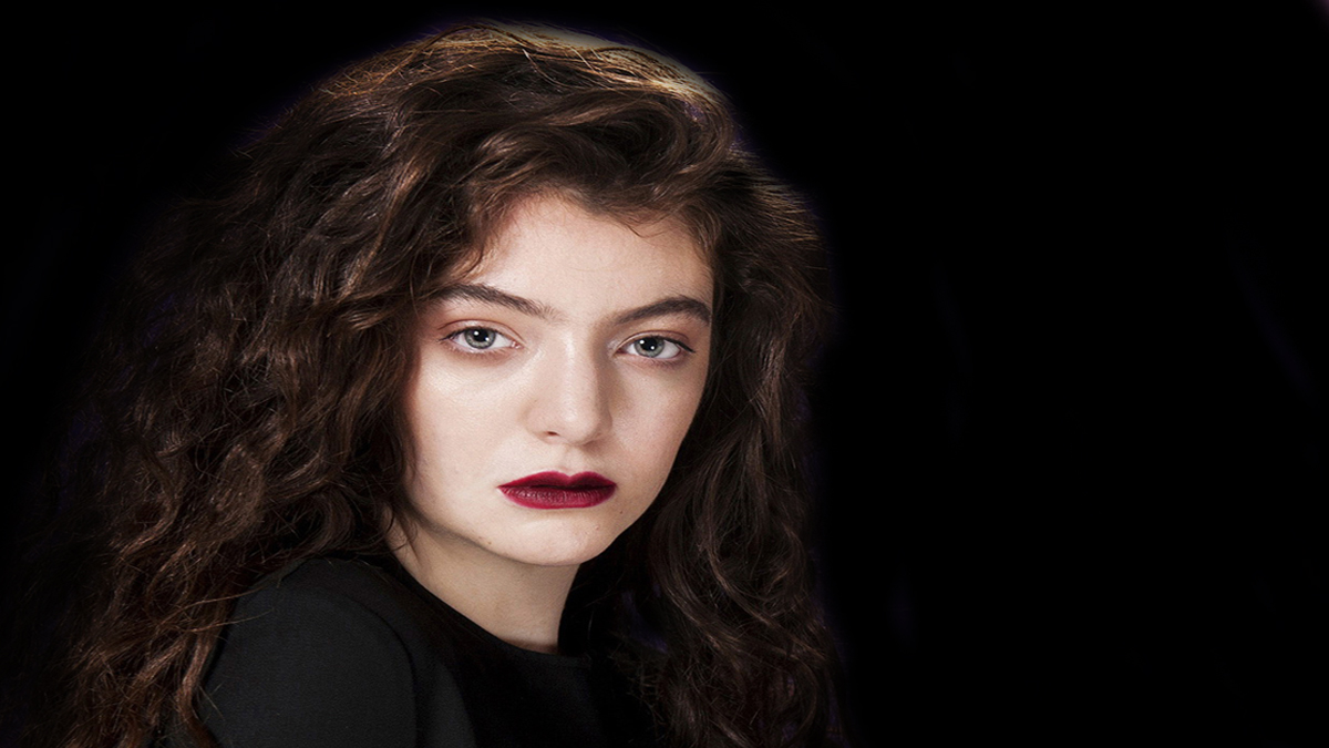 a woman with long brown hair and red lipstick